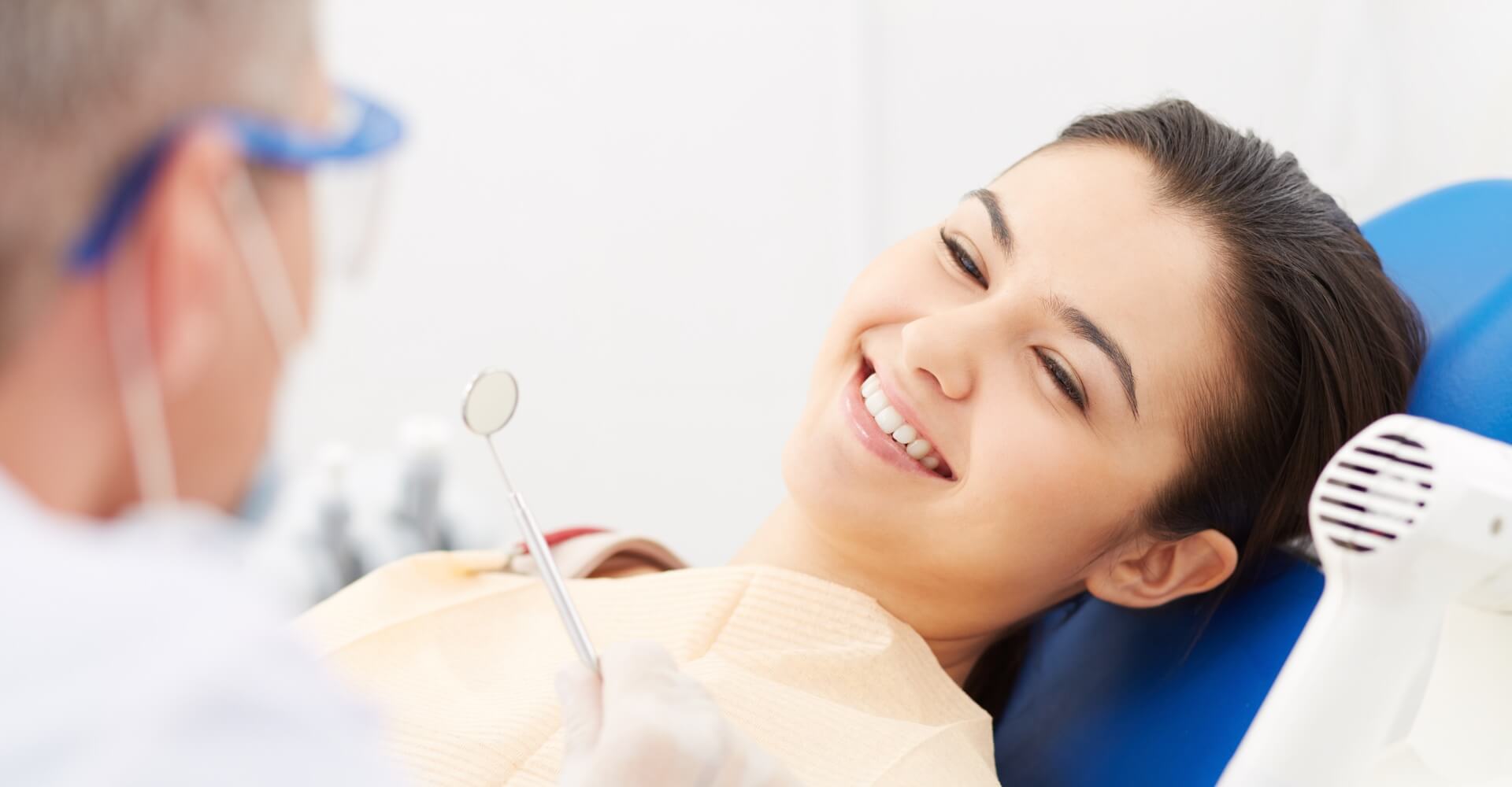 Smiling patient in a dental chair